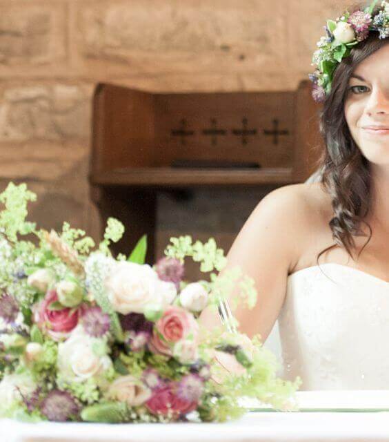Bride with cream and white bouquet